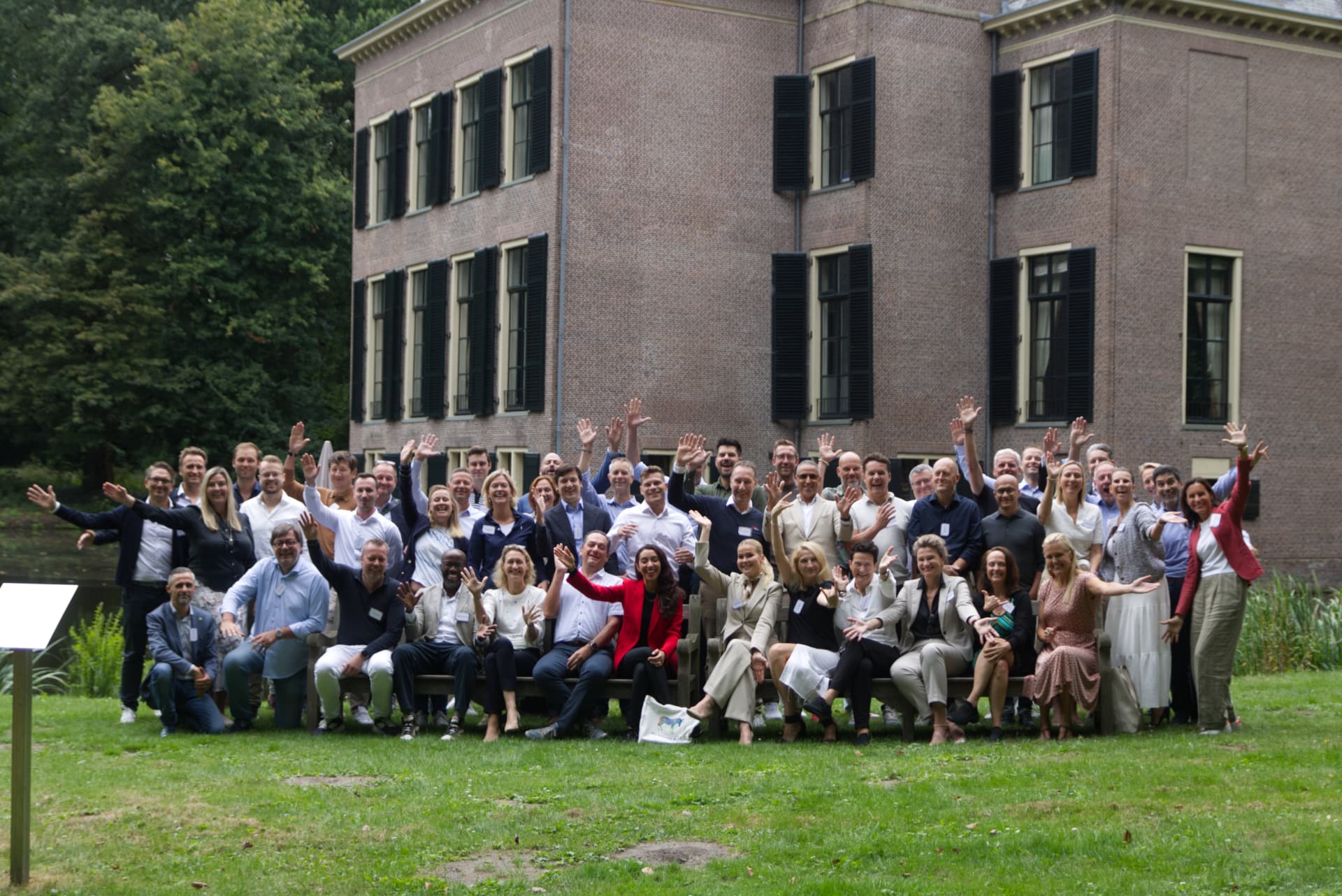 Large group photo of founders and board members Raja Skogland worked with, outdoors